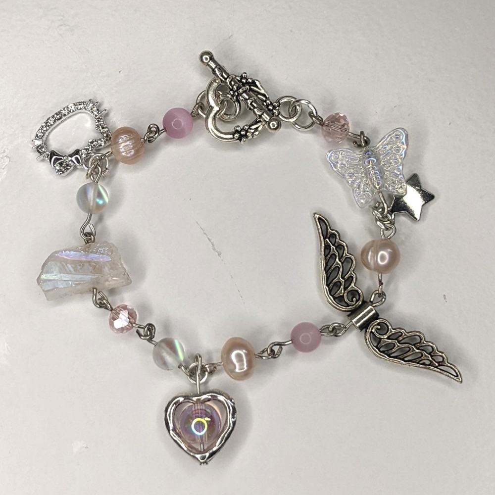 Bracelet with pink crystal beads charms and a toggle clasp. Handmade by me.